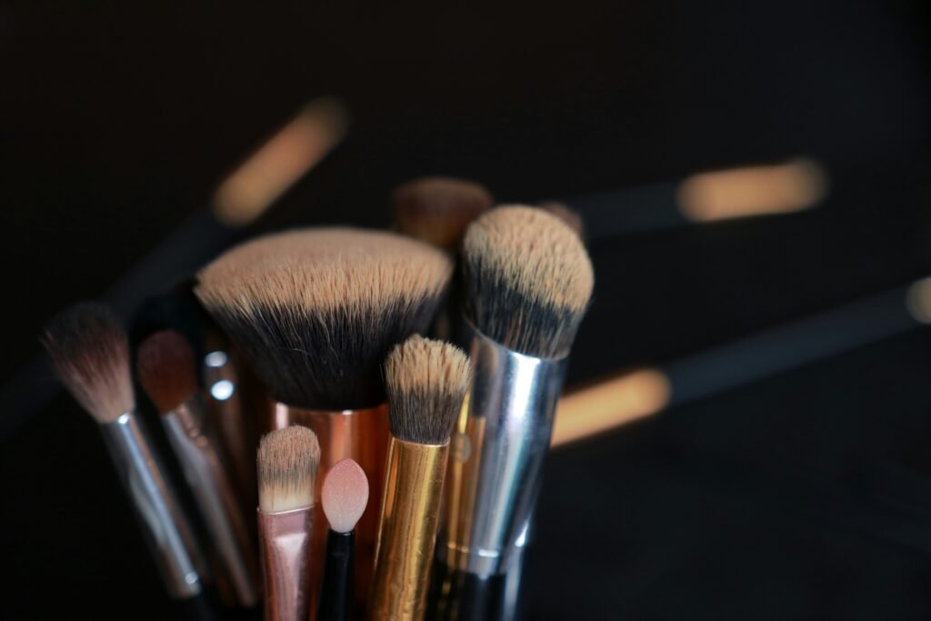 Close-up of luxury makeup brushes with soft bristles, representing professional beauty and skincare services.
